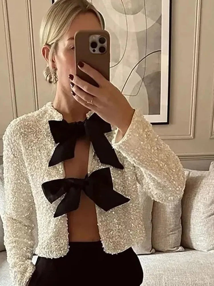 Imani™ | Glitzerndes Oberteil mit Schleife