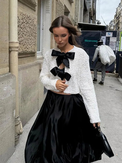 Imani™ | Glitzerndes Oberteil mit Schleife