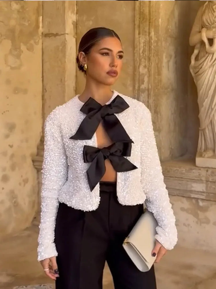 Imani™ | Glitzerndes Oberteil mit Schleife