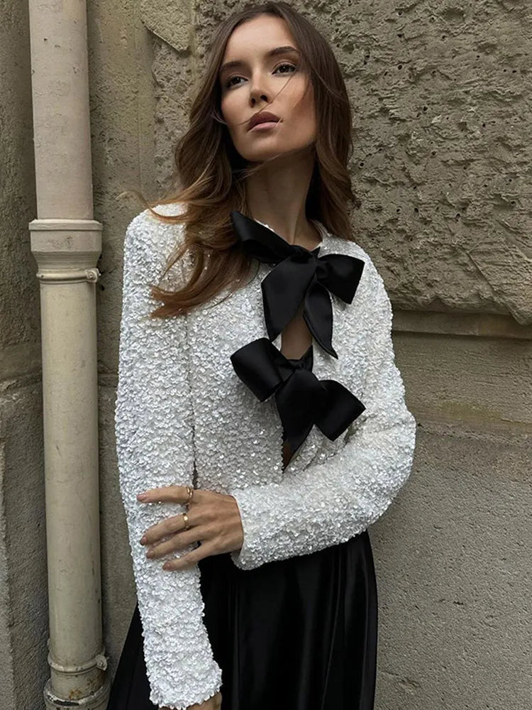 Imani™ | Glitzerndes Oberteil mit Schleife