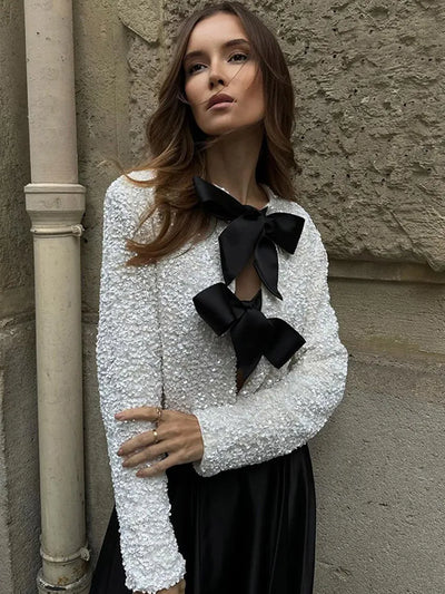 Imani™ | Glitzerndes Oberteil mit Schleife
